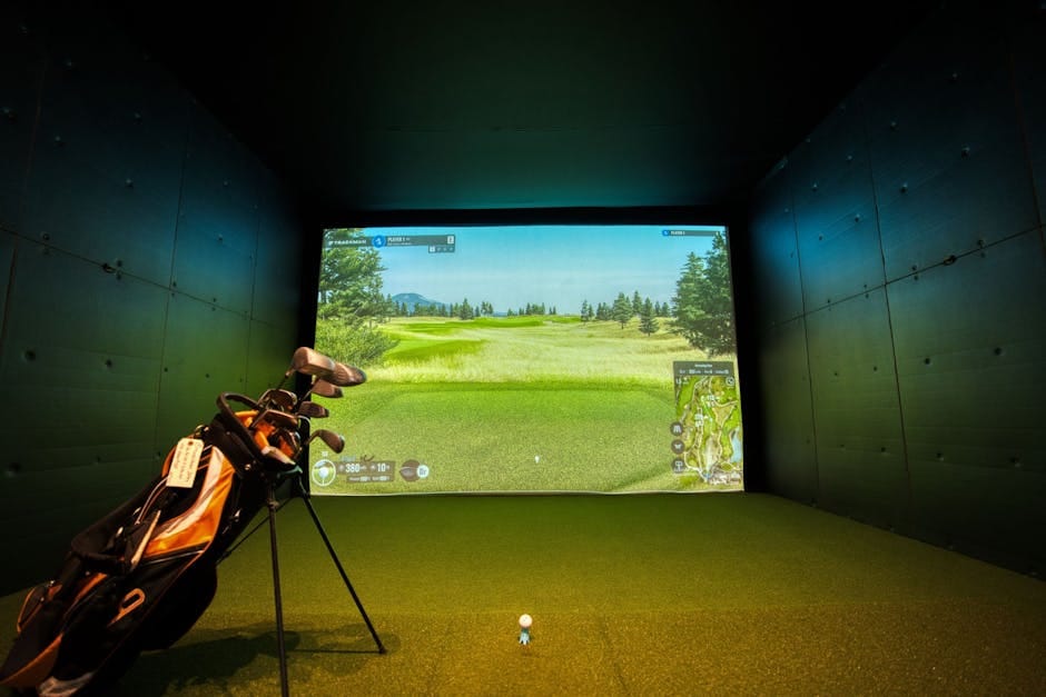 Modern indoor golf simulator setup with projected course display on screen